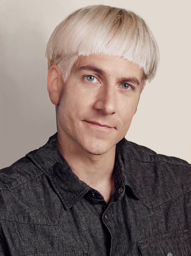A headshot of Matt with a platinum blond bowlcut. Matt has a neutral expression, his head tilted, looking forward. The hair is uniform length on top of his head and cut shorter above his ears. He wears a dark gray collared button-up shirt. The picture is set against a solid tan background.