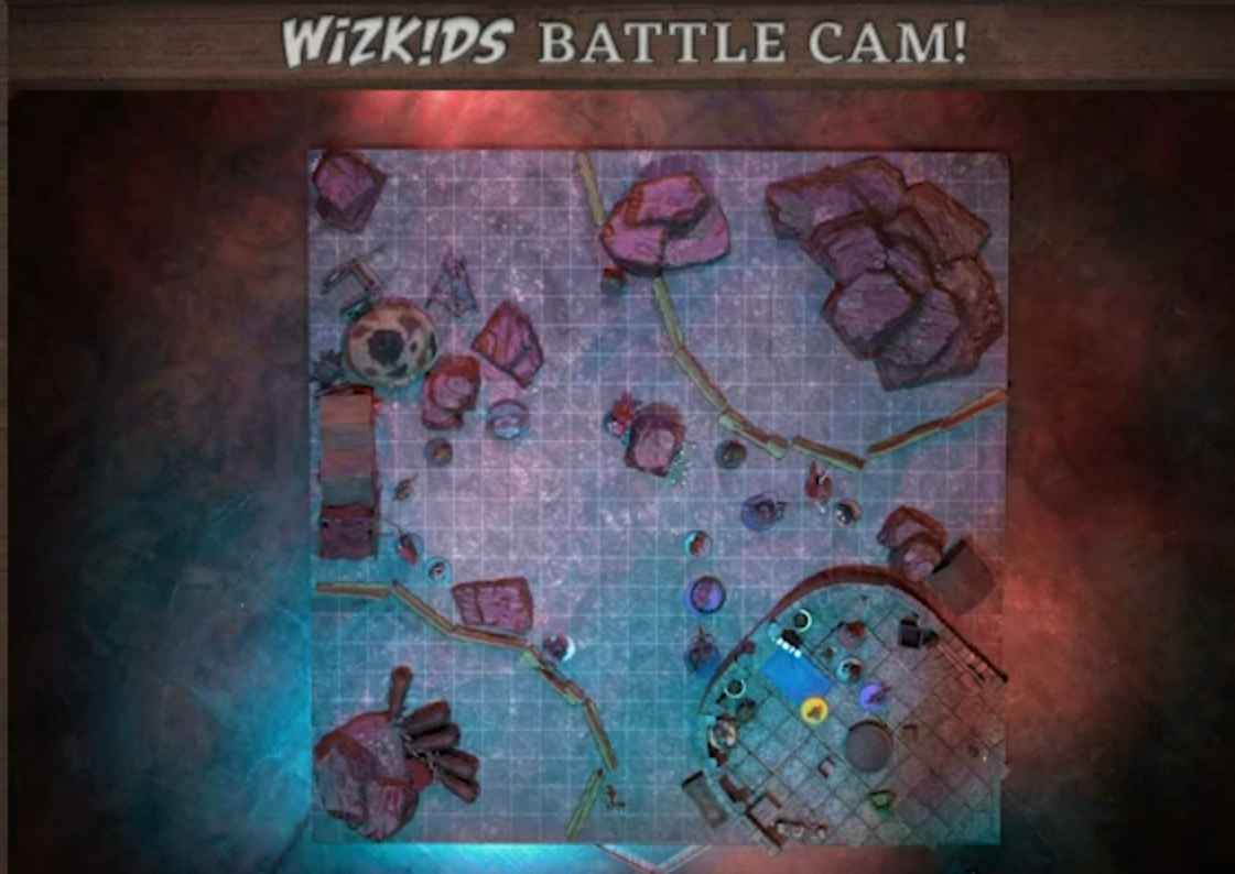 A top-down view of a battlemap of a rounded stone building with an expanse of flat ground outside. The party stands inside the building. There is a group of tokens outside the entance. The rest of the map is filled with large red boulders, fenced areas filled with livestock, and some other scattered tokens.