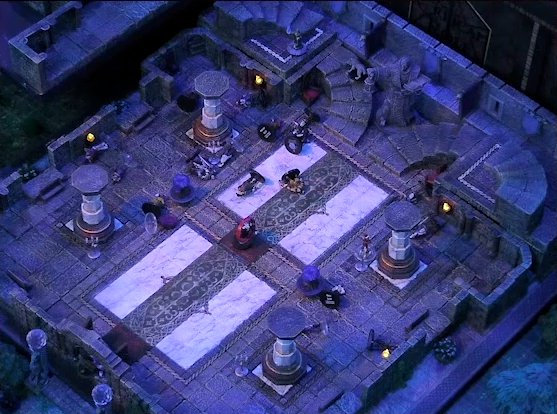A battlemap of a stone palace split into two levels. Downstairs is a marble floor, marble pillars, and twin staircases curving up on either side of a large robed statue holding a lantern and open book. A number of people are laying on the ground throughout the downstairs space. Primus Tachonis is in the center of the floor with a status ring on him. Thaisha in wolf form runs up the left staircase. The edge of the upstairs space is just visible at the left side of the image. The entrance to the palace is framed by two pillars topped with large spherical crystals.