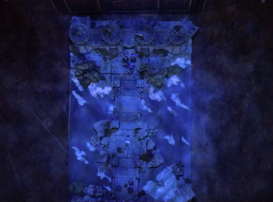 A top-down view of a battlemap of an ornate stone bridge over water leading to a stone wall with parapets and towers. Julien, Mozor, Vaelus, Occtis, Aranessa, and Thaisha stand at one end, while six armored soldiers led by Frons Tachonis stand before a gate in the wall at the other end. Two ballistas are atop the towers. White foam caps waves in the water below.