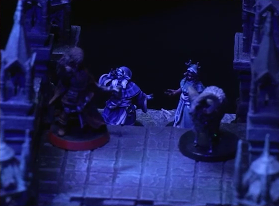 A battlemap of an ornate stone bridge focused on Thaisha, Aranessa, and Hala standing at one end. Behind them are Agony and Cruelty standing next to each other.