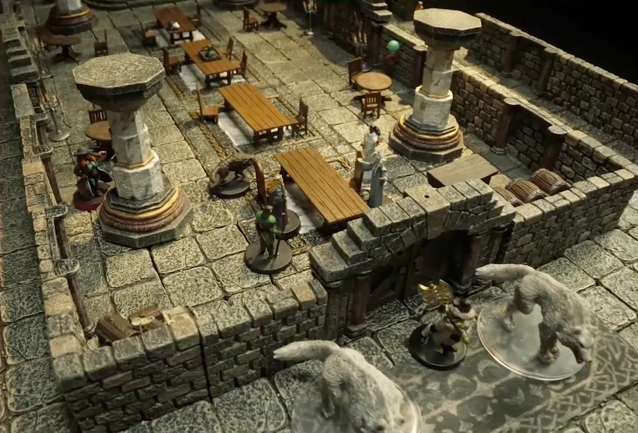 A battlemap of a large stone banquet chamber with surrounding hallways. King Augustus Valian, a Hound, and a druid sit across a table from Photarch Yanessa and an attendant Lux. Murray hides behind a pillar near the table. Outside the closed south entrance of the chamber, Filoneus Halovar stands with his two dogs Wrath and Judgement, wielding a large axe. Inside the chamber are some long tables and chairs, marble pillars holding up the ceiling, and green globes spaced along the walls.
