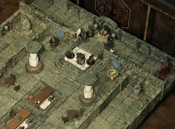 A battlemap of a large stone banquet chamber with surrounding hallways. At the north entrance, assassins enter the chamber and surround a Hound of the King. Azune and Bolaire stand at one end of the north hallway. A red status ring is around Bolaire. Inside the chamber are some long tables and chairs, marble pillars holding up the ceiling, and an orrery.