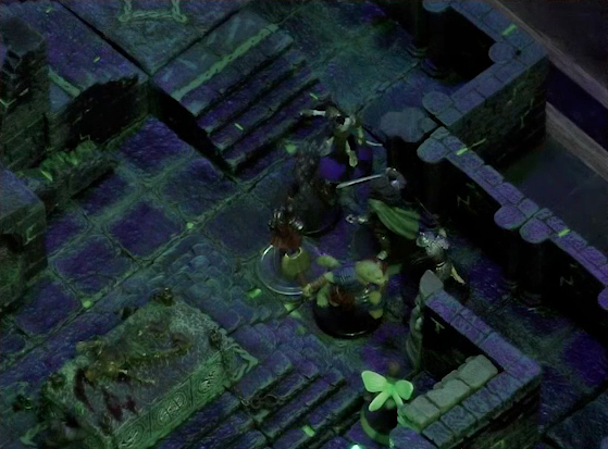 A battlemap of a stone chamber. Talcydimir, Dame Gaya Seremai, Julien, and Thimble face off against two armored skeletons and a shadow. Off to their side is a stone altar with a skeletal corpse on top of it. Behind the altar is a circular hole leading into the wall. A staircase rises up to the side of the hole. The room is lit by a sickly green glow.