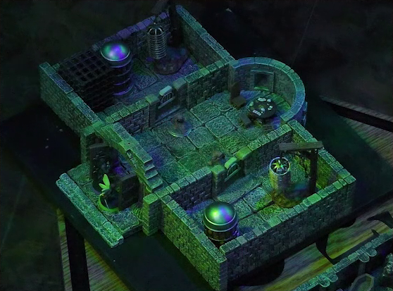 A battlemap of a stone aviary split into three rooms. Occtis and Thimble stand outside an open door into the main chamber, in which are two ghouls and a circular table with a card game abandoned on it. To the left of the main chamber is a closed door leading to a room with a large cubic black metal cage, a large cylindrical silvery metal cage, and a large cylindrical metal hanging cage resembling a bird cage. To the right of the main chamber is a closed door leading to a room with the same kind of silvery metal cage and hanging cage, although there is no large cubic cage.