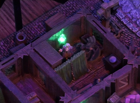 A battlemap of a street-side tailor shop eerily tinted purple and lit by glowing green torches. Kattigan faces off against Calastro Mercanaud behind dividing curtains in one room. Calastro stands just beneath a green torch on the wall. The edge of an adjoining room is visible at the corner of the image. A third room is off to the side without a clear connection to the rest of the building. This room has stairs leading below ground.