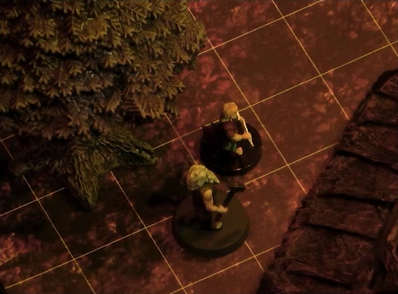 A battlemap focused on Garen, wielding a hammer, and a villager, holding what appears to be a flute or small tool. They stand between a wooden building and a green leafy tree.