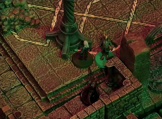 A battlemap of a stone temple interior. Rei’nia and Erro stand next to a stone pillar with a helical pattern of lines running up its length. A red devil stands just behind them.