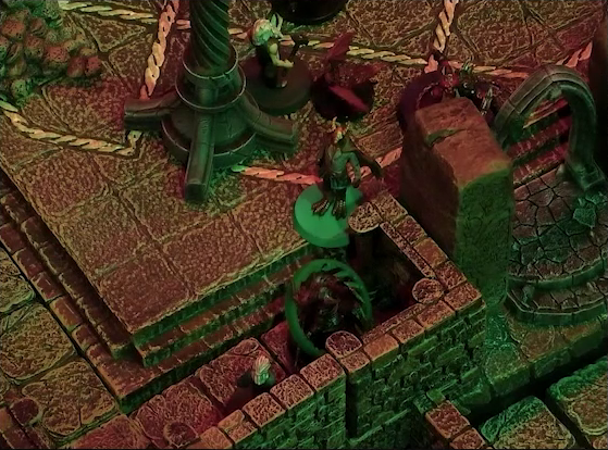 A battlemap of a stone temple interior. Rei’nia and Erro surround a red devil with a status ring around it. Garen is a bit further into the room, facing off against a winged imp and a red devil with metallic spikes and pincers.