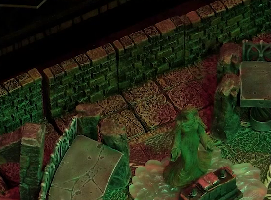 A battlemap of a stone temple interior focused on a statue of the Moonweaver who is rotated in her original direction away from the back wall. The statue stands on a bed of white crystal behind an altar with an open book on it.