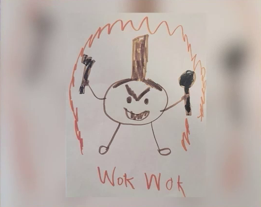A child’s marker drawing of a frying pan with an angry face, its handle emerging straight up from the top of its head. It smiles, revealing sharp teeth. It holds a fork in its right hand and a spatula in its left hand. Underneath it in orange text is written “Wok Wok”. Around it is an orange border in a shape like an aura.
